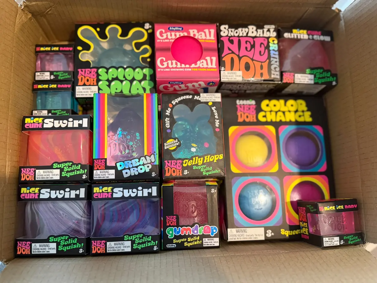 A delivery box filled with colourful NeeDoh toys