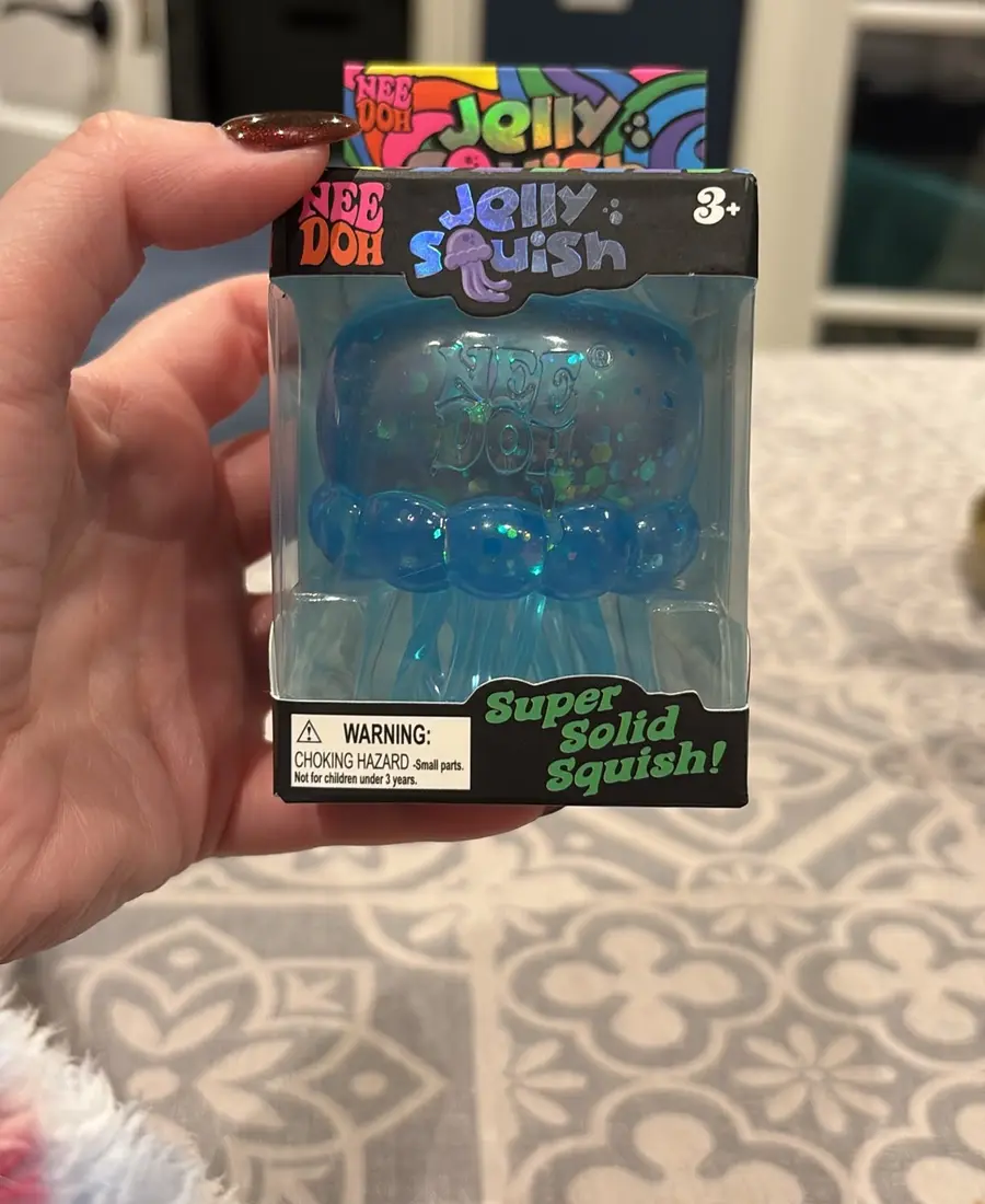 A blue NeeDoh Jelly Squish from Sophie's collection